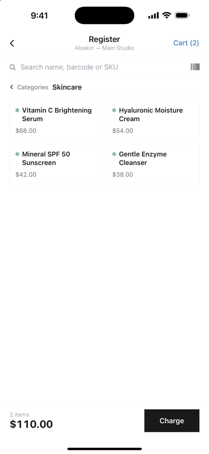 The phone's register: a Skincare category with two items in the cart, $110.00, ready to charge